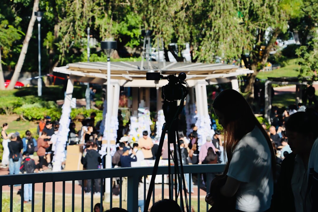 Video crew filming a live cultural event interview outdoors